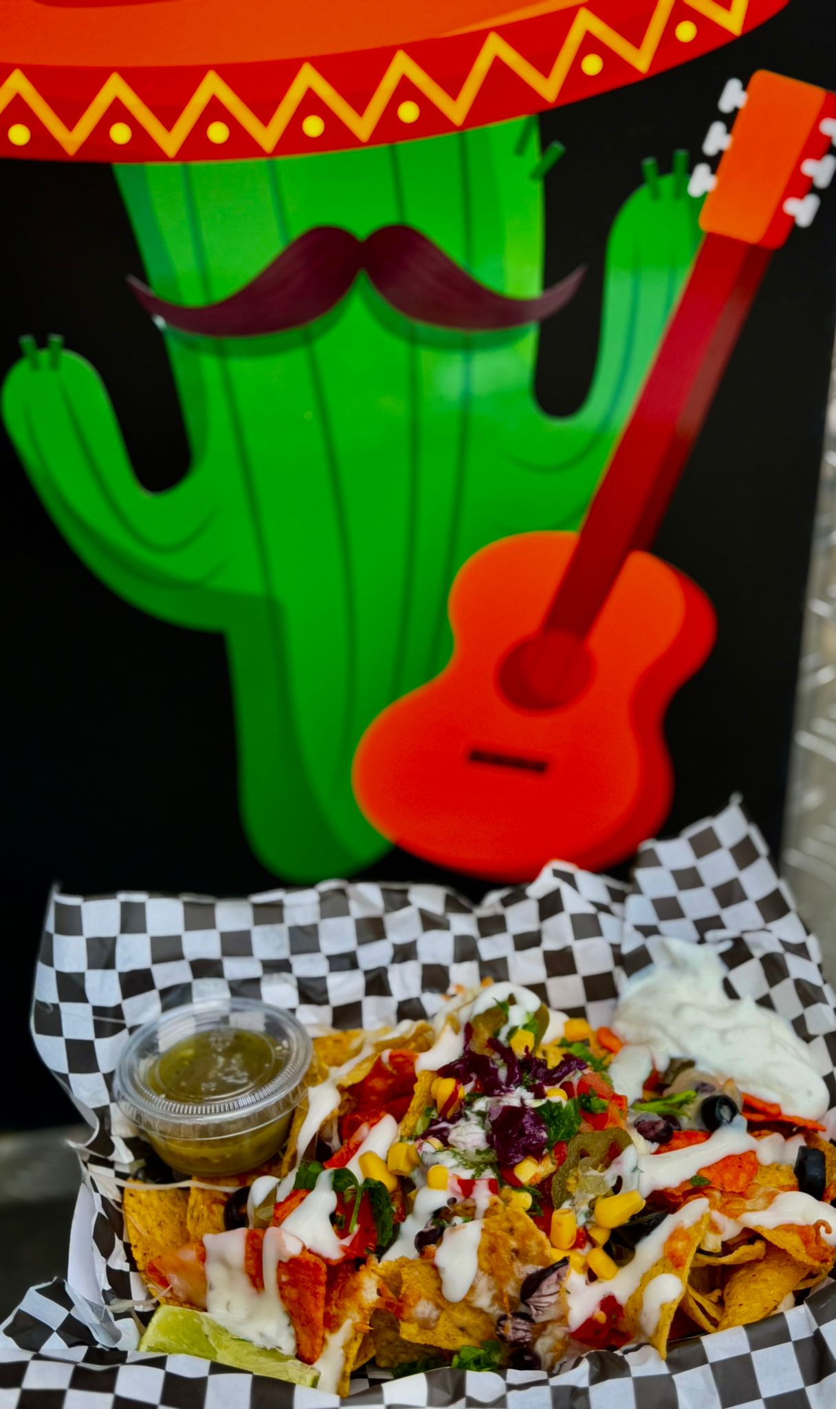 Tackia cactus logo with guitar
